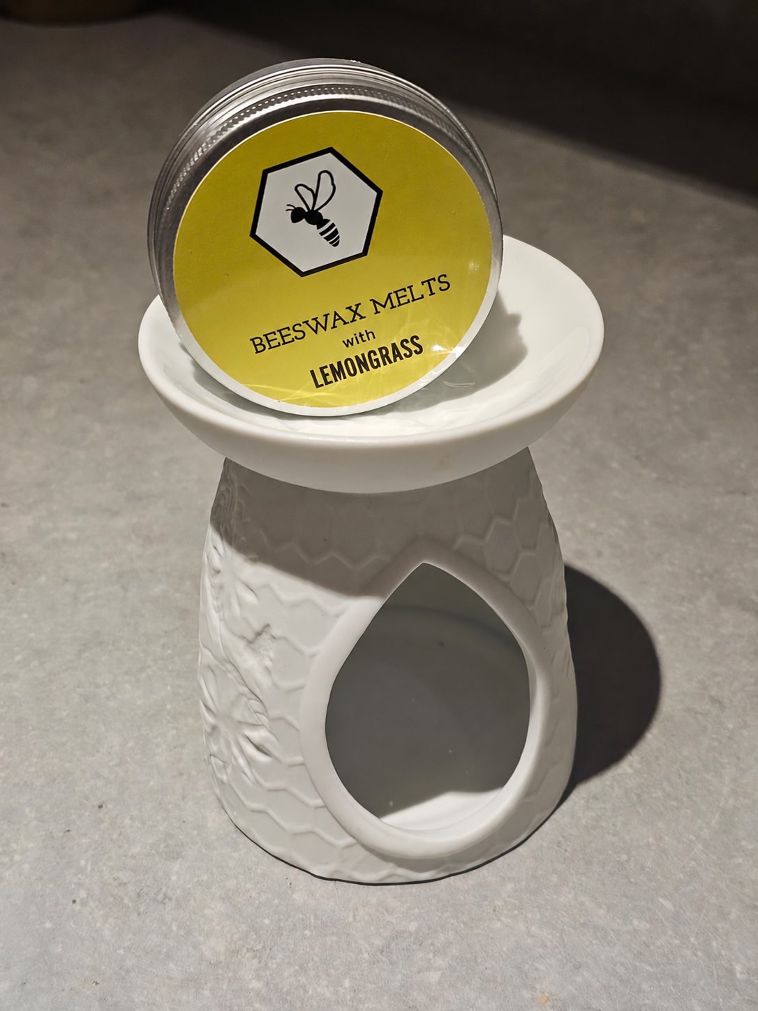 White tea light wax melt burner with a tin of Lemongrass beeswax melts