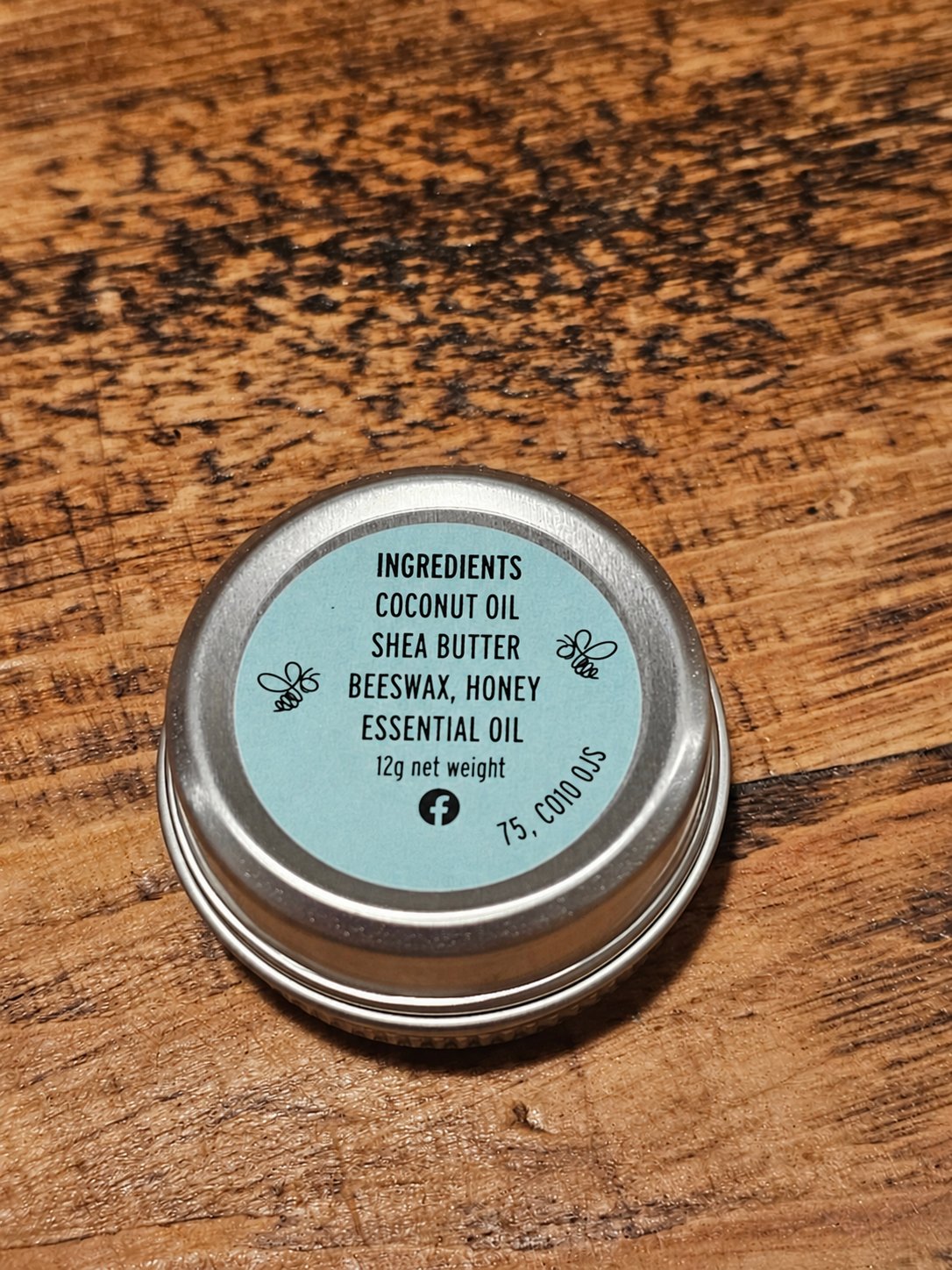 Peppermint Beeswax Lip Balm 12g showing the ingredients label on the back