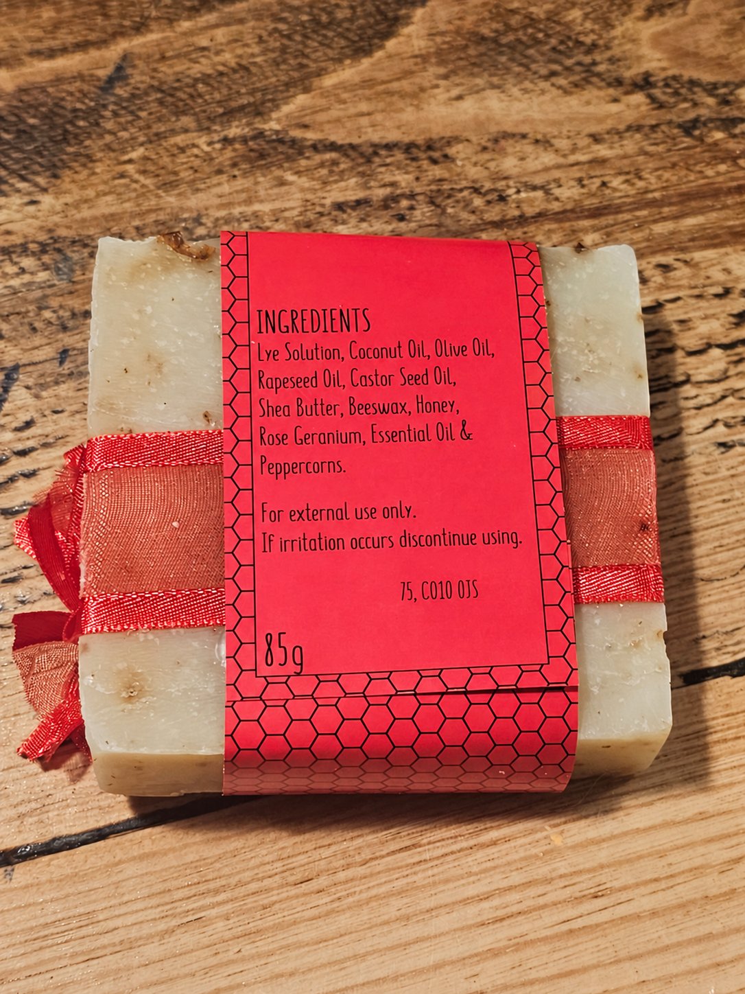 Rose & Peppercorn Honey Soap 85g showing the ingredients label on the back