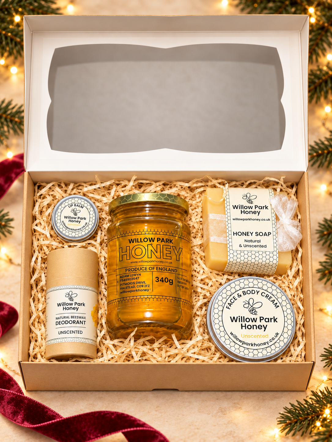 Open unscented Christmas gift set with optional honey, pine sprigs, warm lights and burgundy ribbon