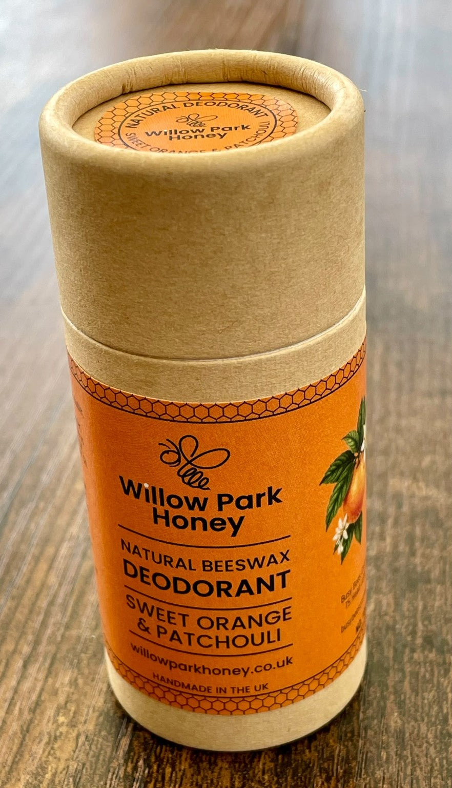 Sweet Orange & Patchouli natural beeswax deodorant by Willow Park Honey in a cardboard tube