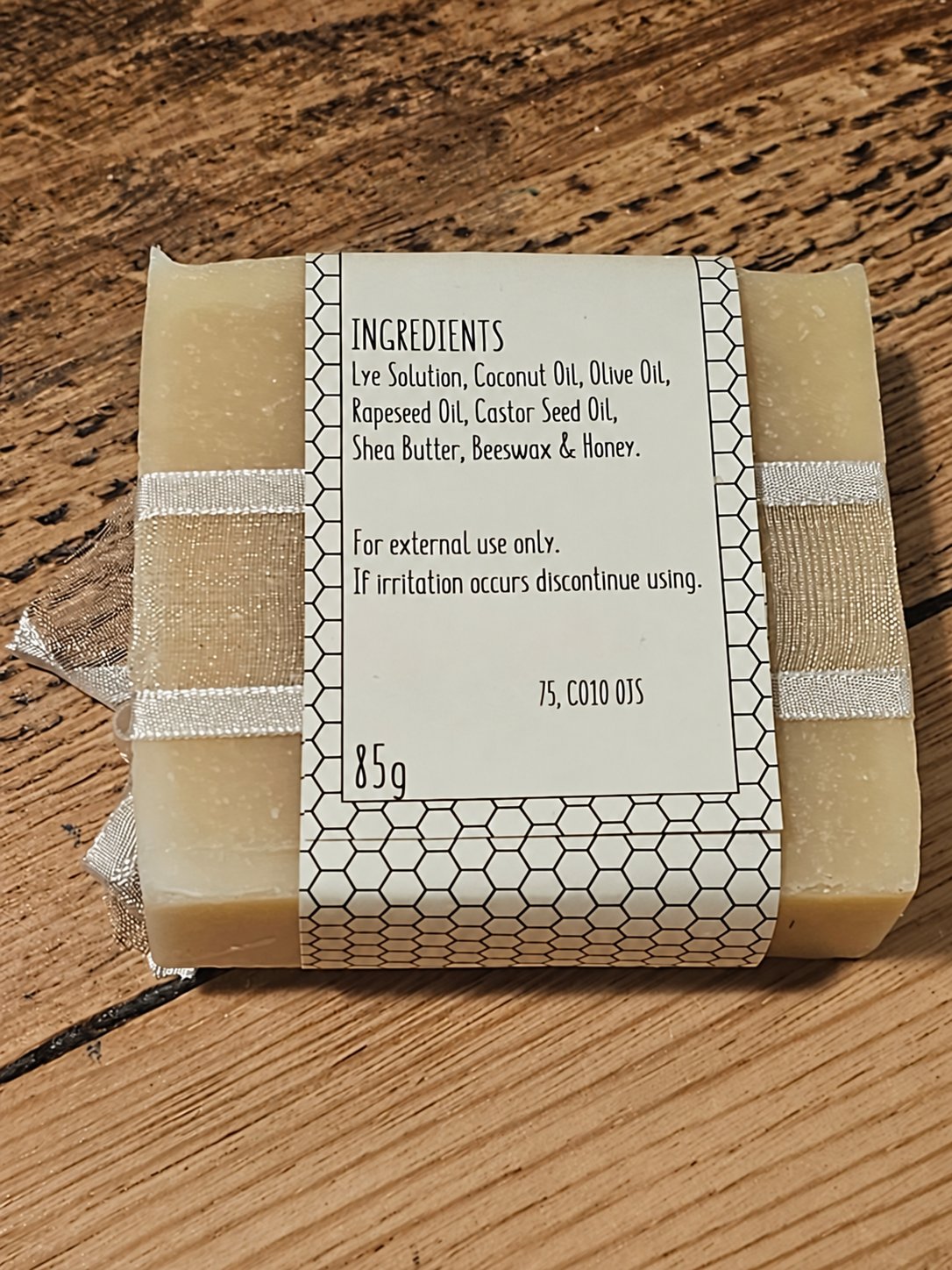 Natural & Unscented Honey Soap 85g showing the ingredients label on the back